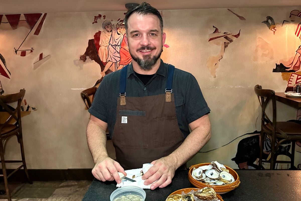 Chef Jason Peabody shucking oysters