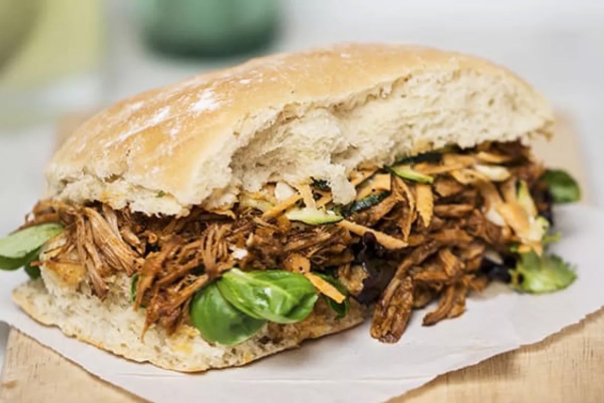 Pulled pork sandwich with basil.