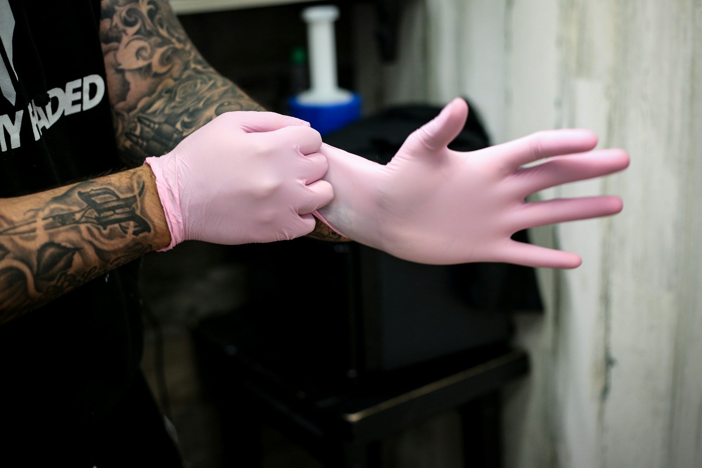 A chef putting on rubber gloves