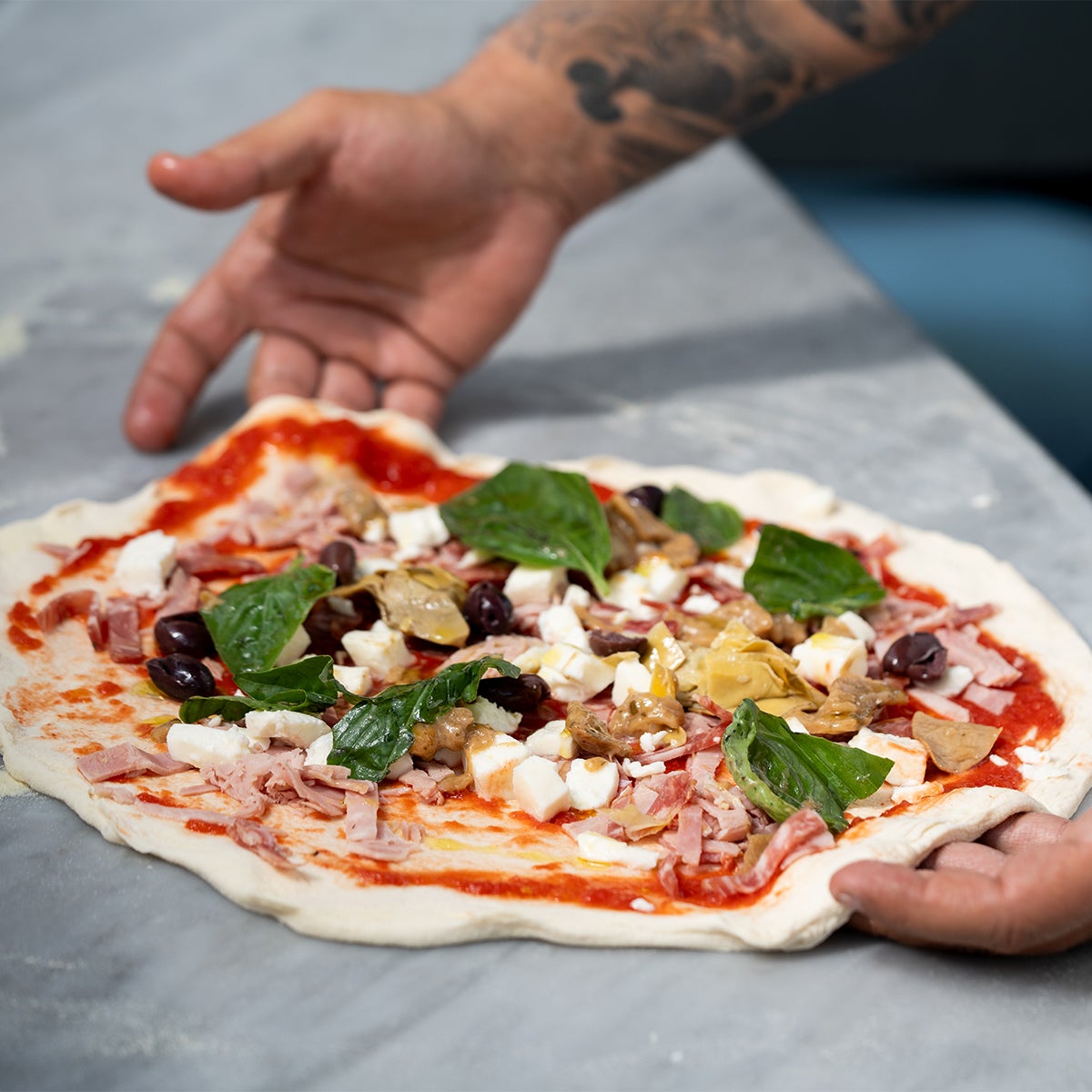 A capricciosa pizza ready for the oven.