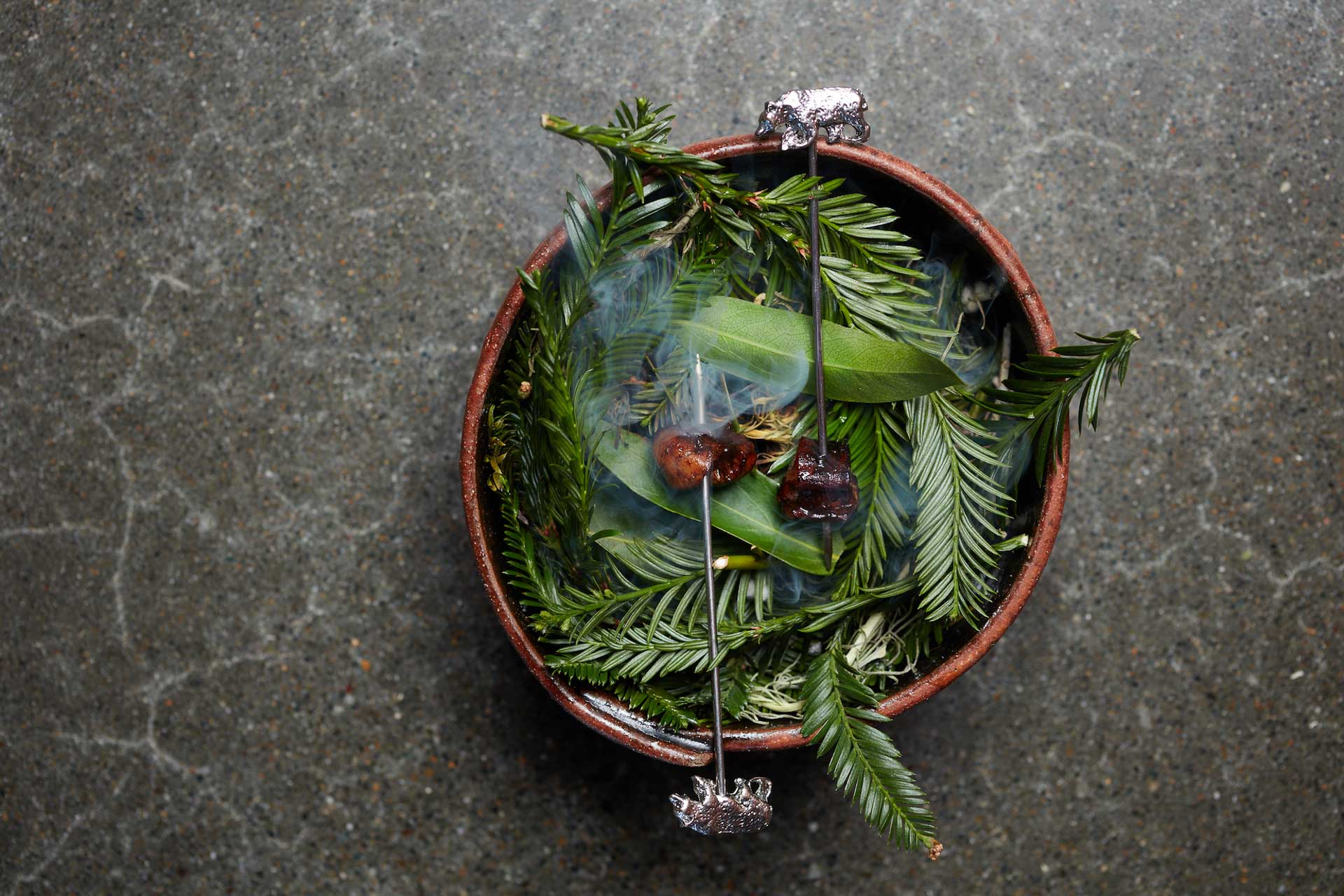 Dish with green leaves seen from above