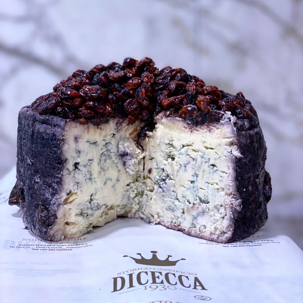 A wheel of cheese cut open.