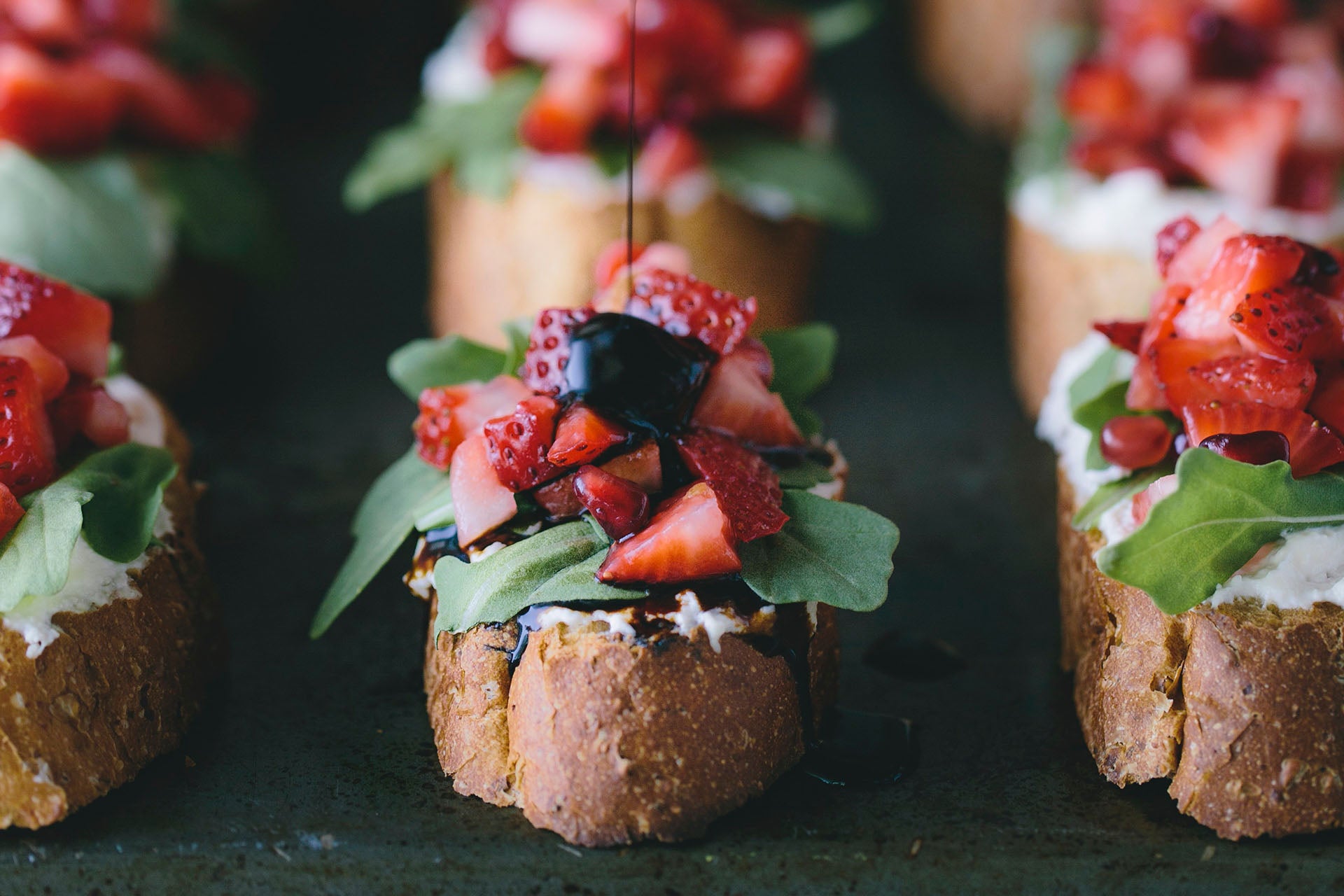 Savory Strawberry Appetisers_A platter of balsamic reduction and strawberry bruschetta