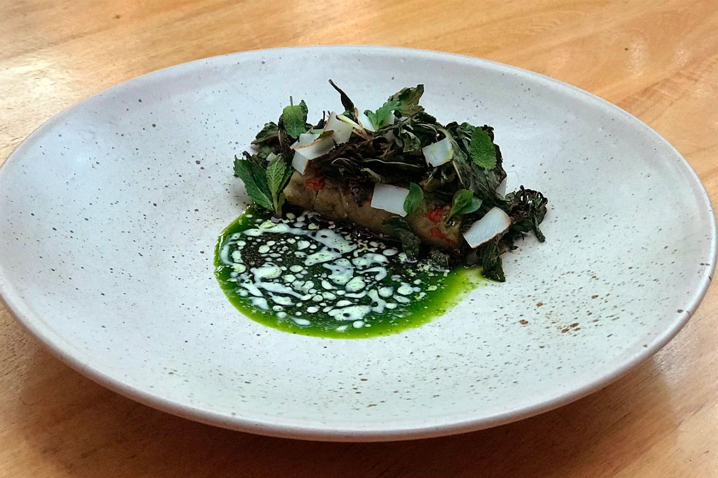 El Chato's dish with coca leaf