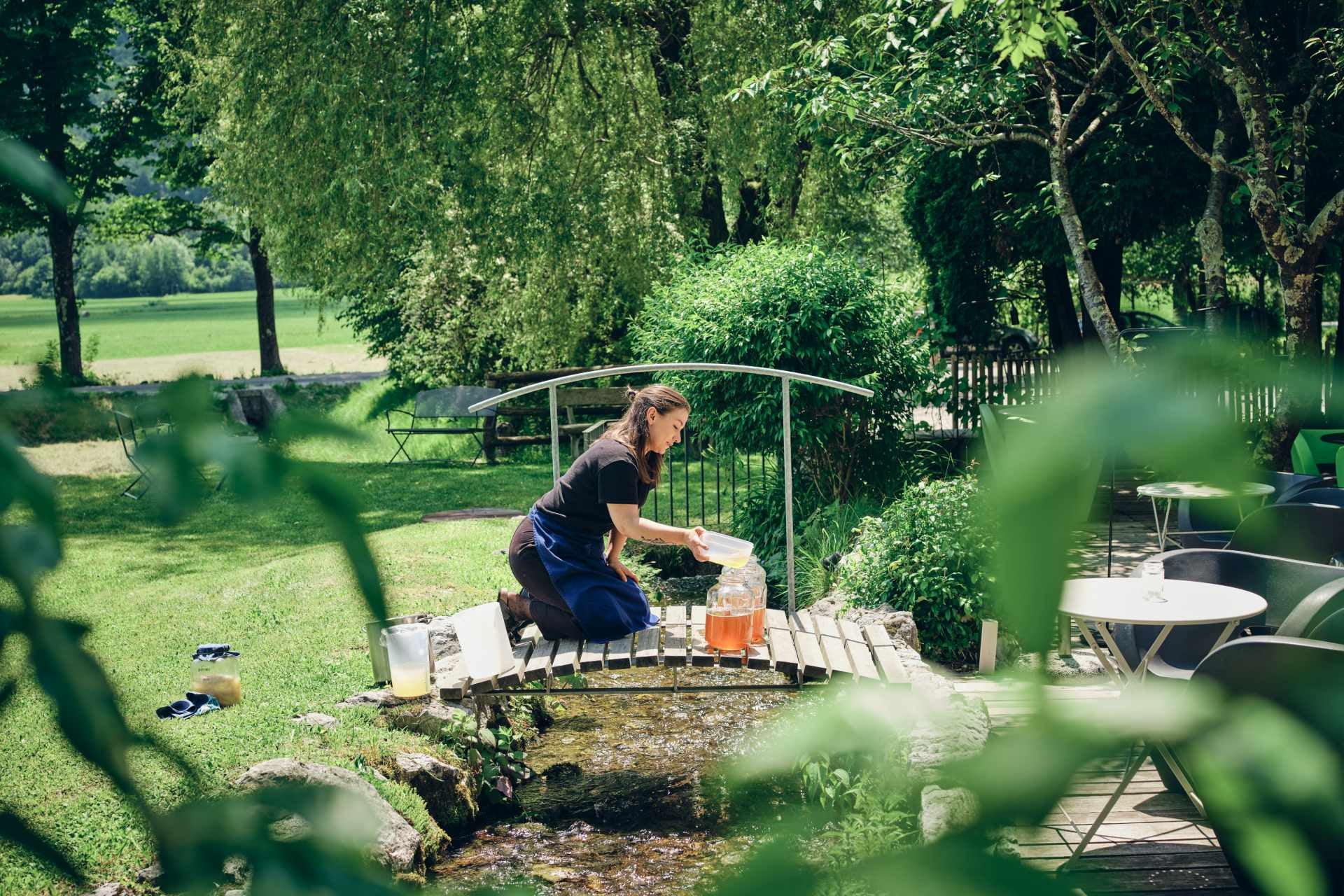 A woman in a garden.