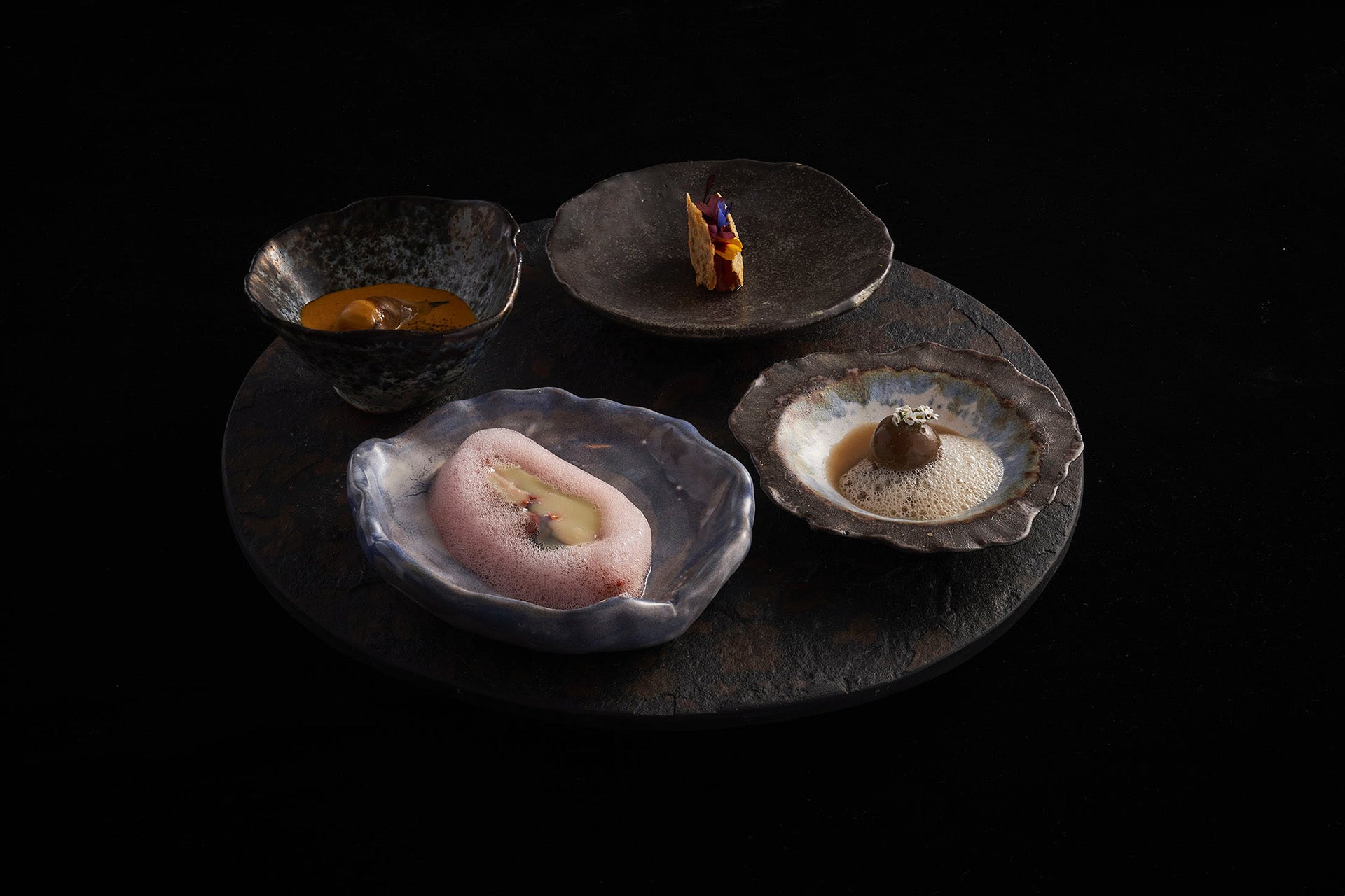 LEO's aperitivo. Four dishes containing small delicacies