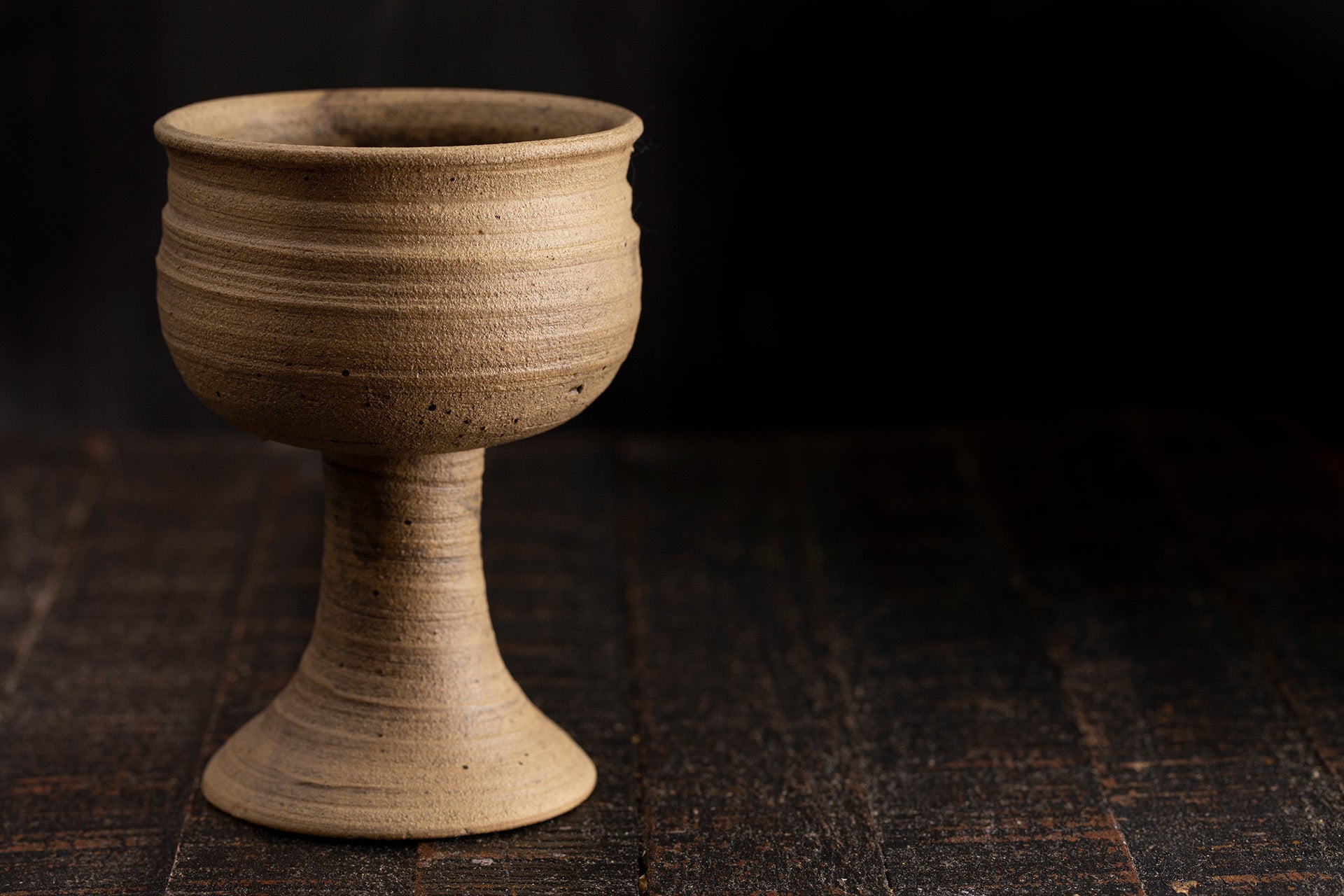 Still life of a terracotta wine glass