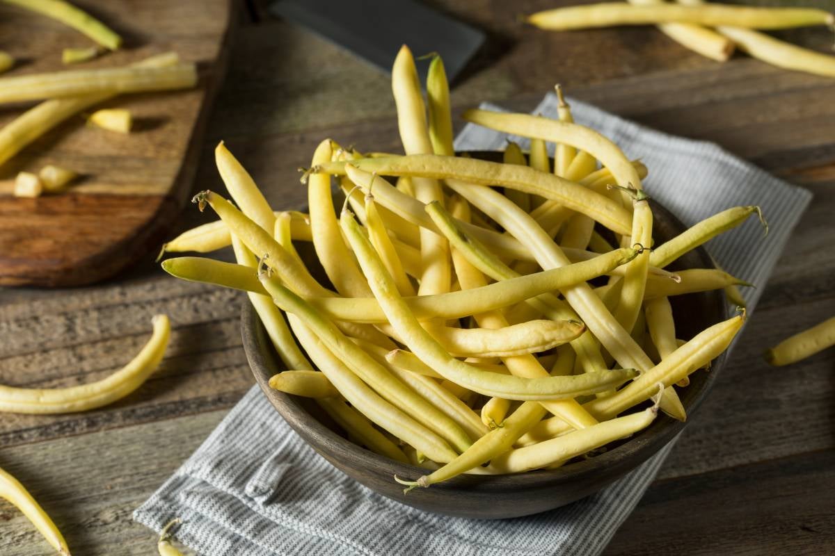 Bowl full of Yellow wax beans, a variety of green beans, known as  yellow beans or butter beans