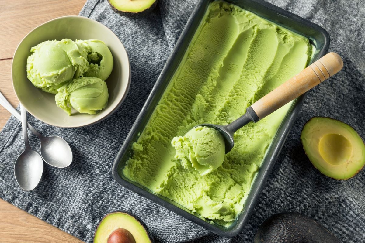 Serving homemade creamy avocado flavoured ice cream
