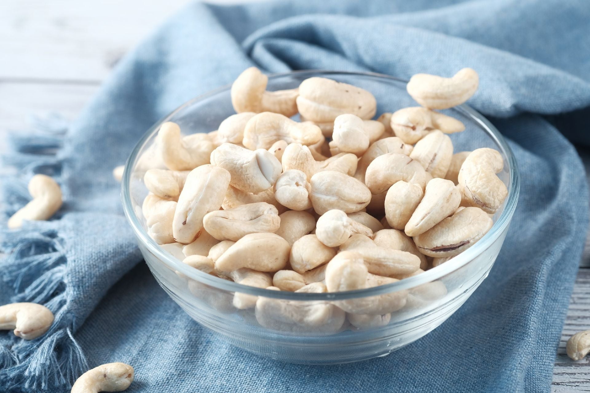 a glass bowl of cashew nuts