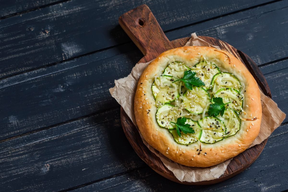 A vegetarian version of Italian pizza with zucchini topping