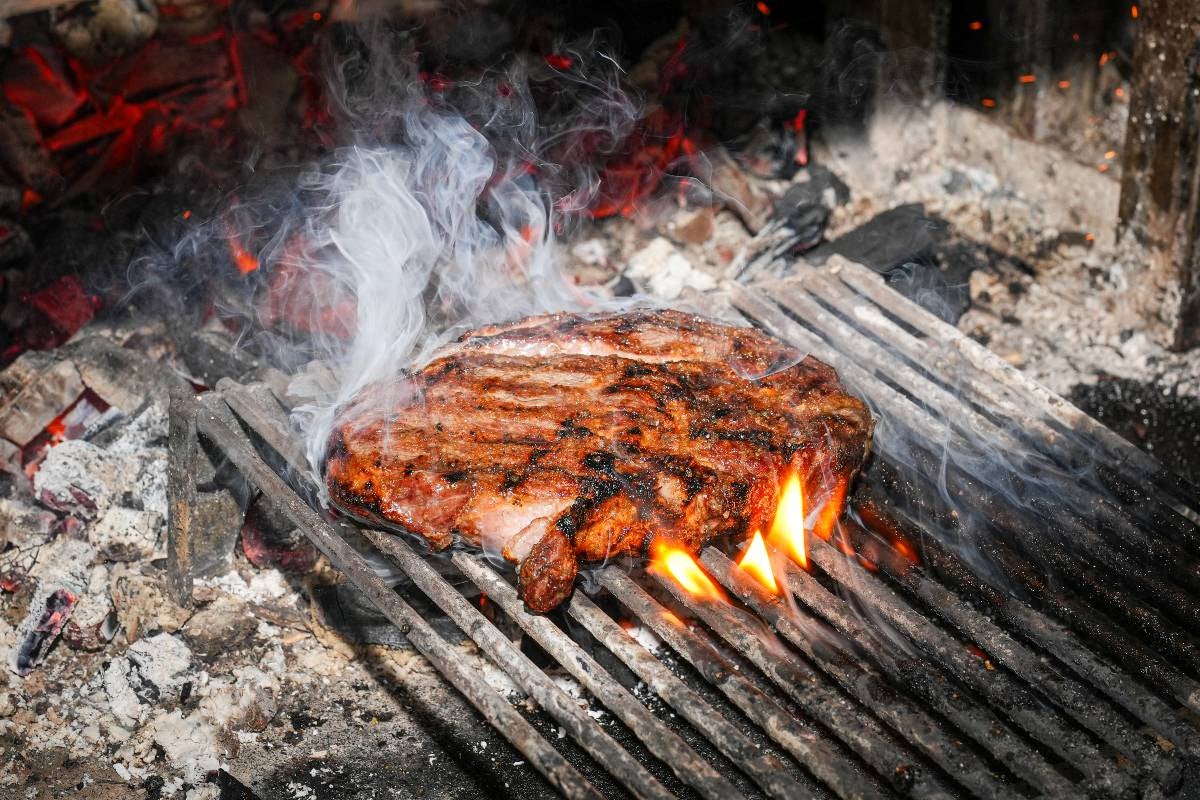 Meat cooking on embers.