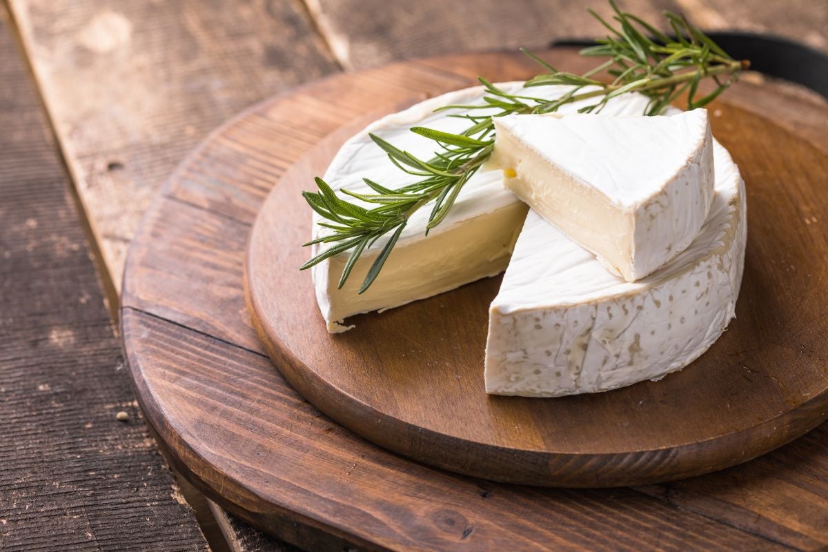 A piece of Brie, a soft farmhouse cheese originated in France