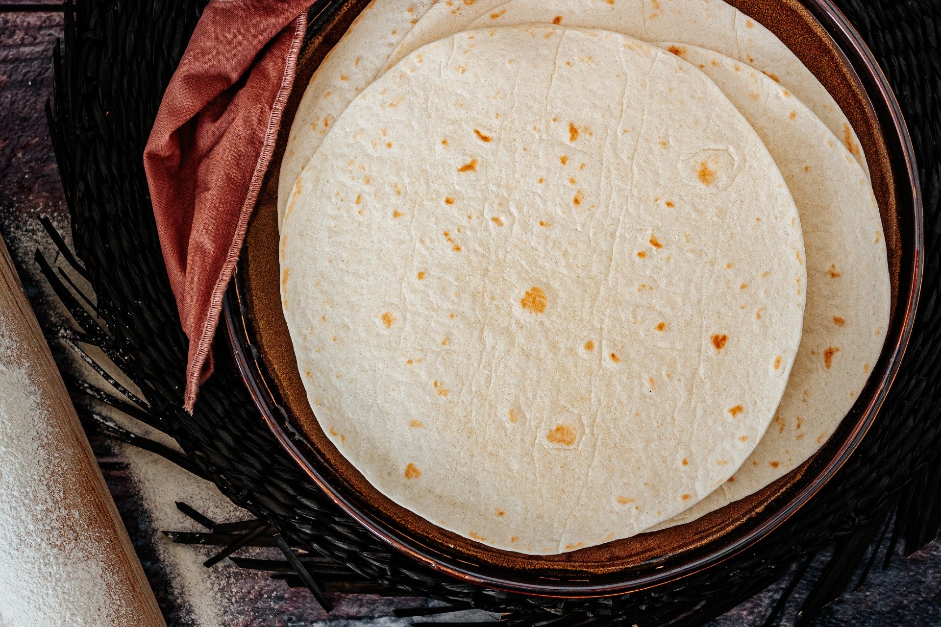 a stack of fresh corn tortillas