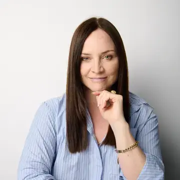 Journalist Alexandra Carlton in a blue shirt.