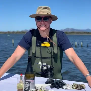Journalist Chris Dwyer by the water in Tasmania.