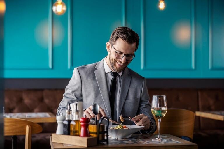 A man enjoying a meal in a restaurant.