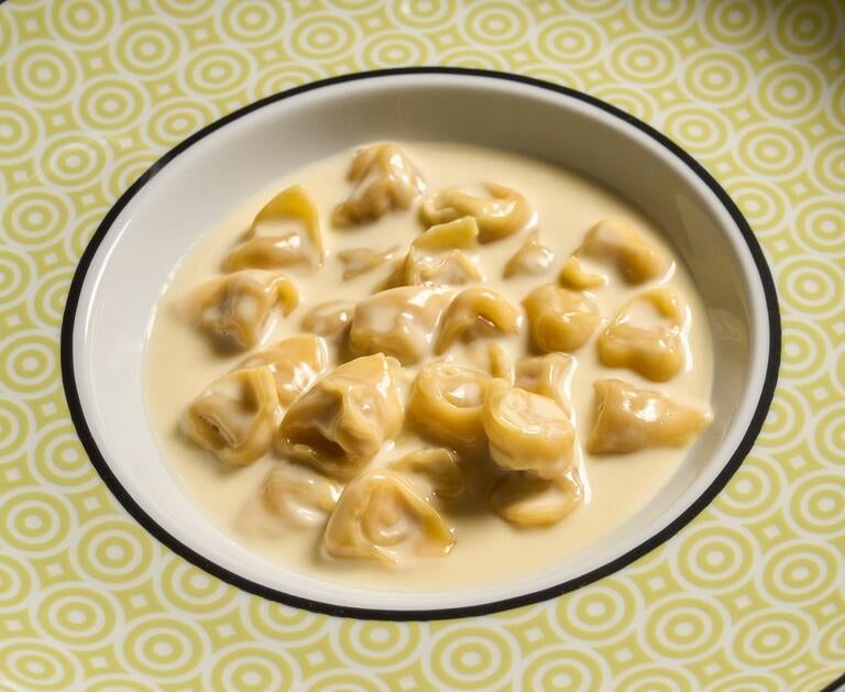 A plate of tortellini in cheese sauce at Torno Subito.