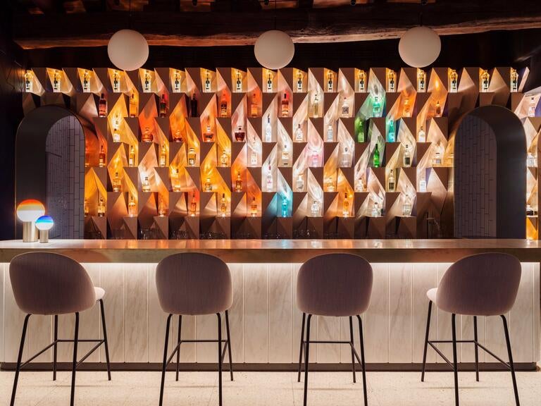 Seats at the bar at Saint in Monza.