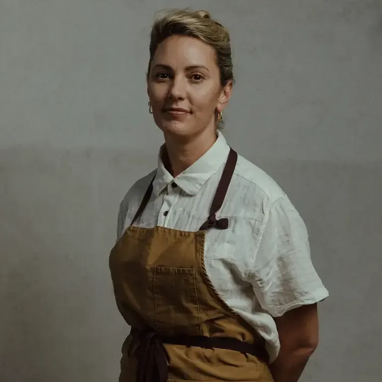 Chef Alanna Sapwell in a brown apron.