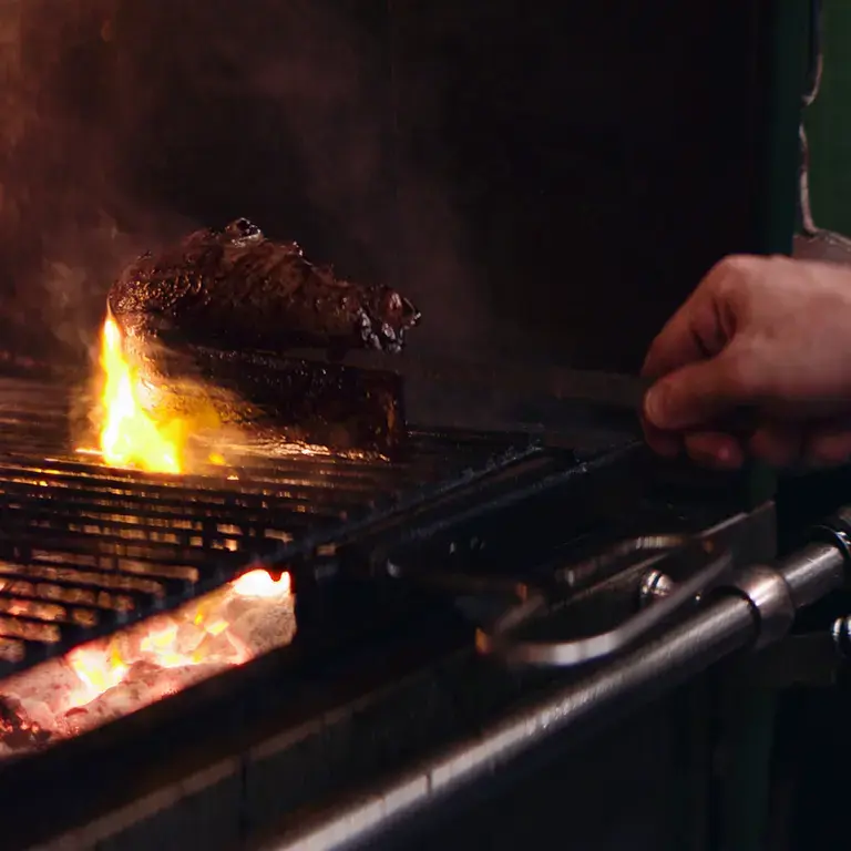 Meat on the grill at Firecat.