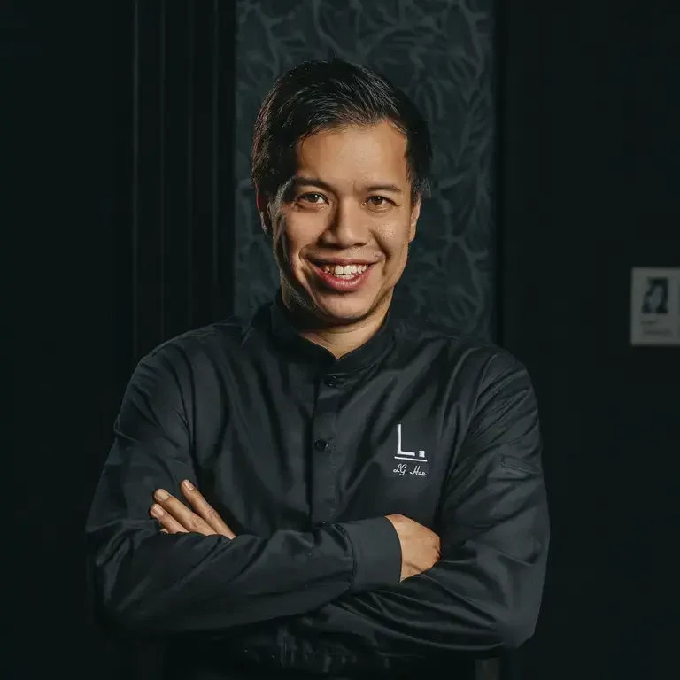 Chef LG Han, dressed in black.