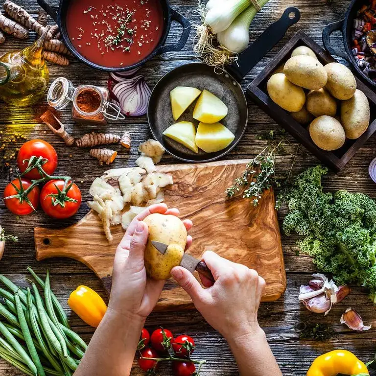Woman cooking vegetarian meals.