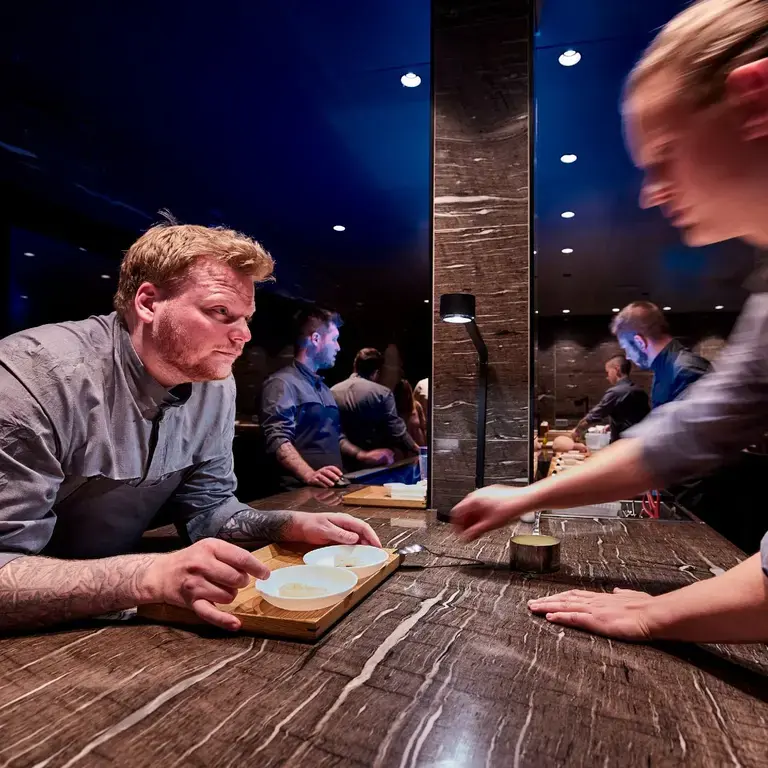 Head Chef Rasmus Munk plating the impression King Crab together with chef Rasmus Bermann.