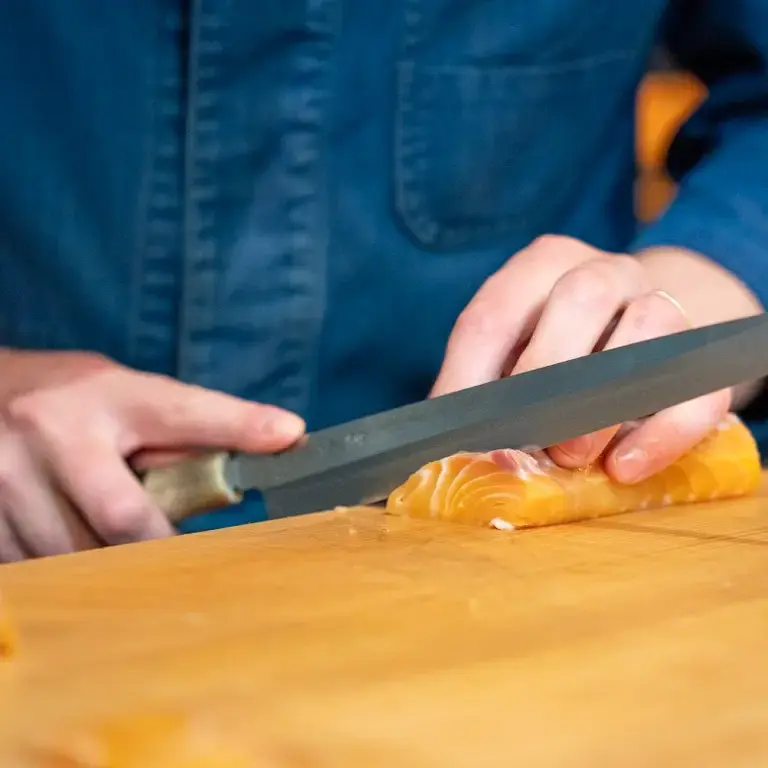 Slicing salmon at Affinity Fish.