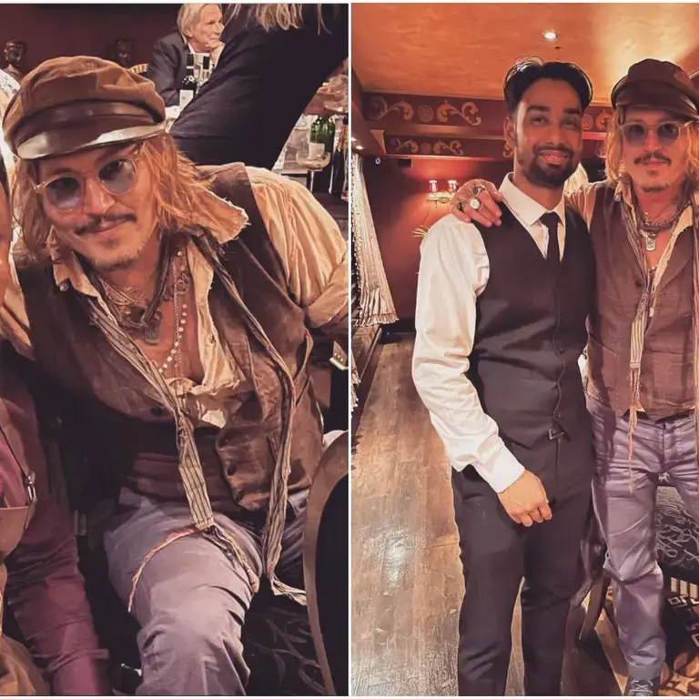 Johnny Depp posing with staff at Varanasi restaurant