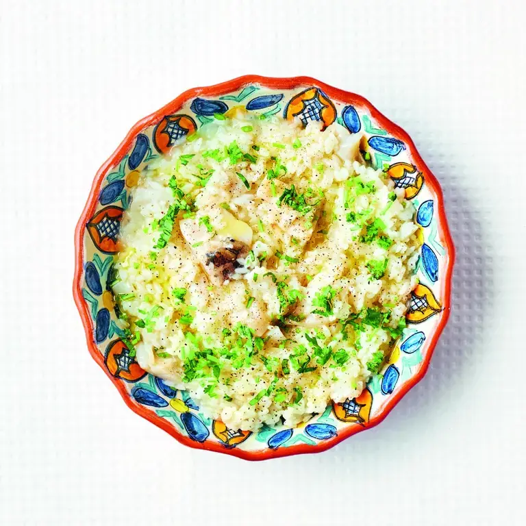 A bowl of arroz de bacalhau by Leandro Carreira.