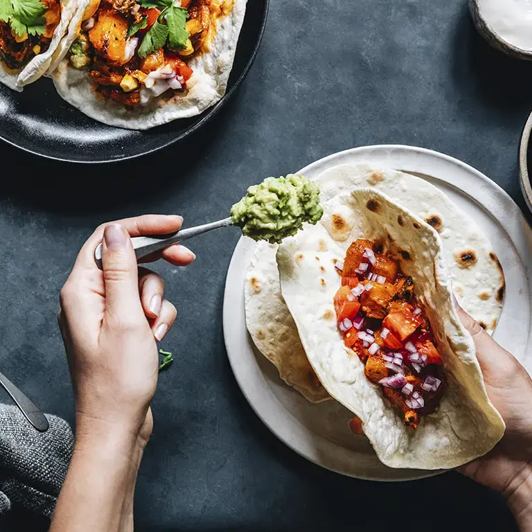 Tacos being served at a table
