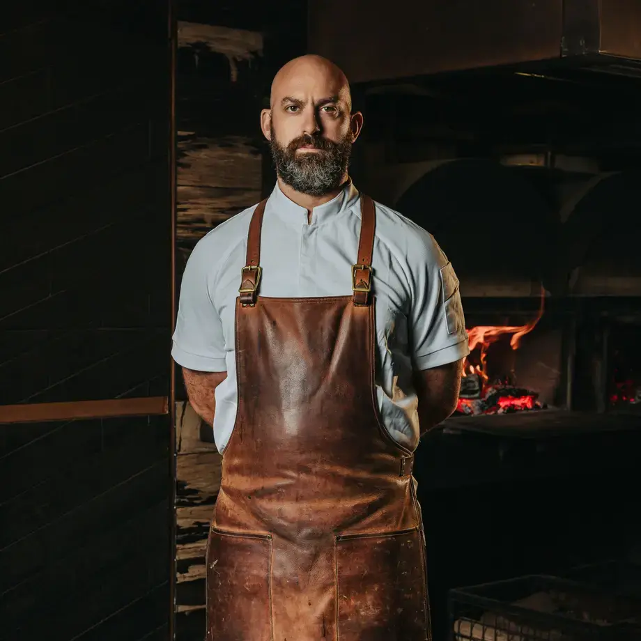Chef Dave Pynt in a brown apron.