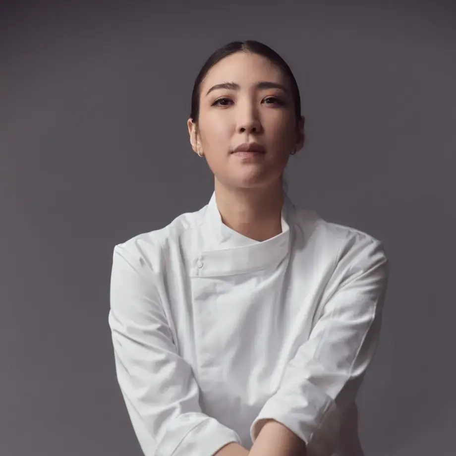 Chef Pam sitting cross-legged.