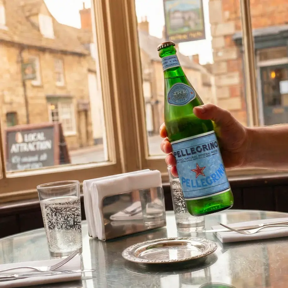 S.Pellegrino at a restaurant table in an English village.