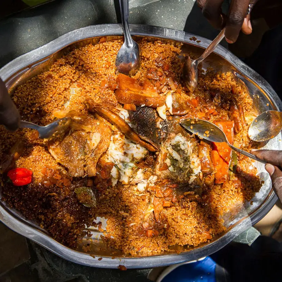 overhead-shot-large-platterof-food-with hands-holding-spoons
