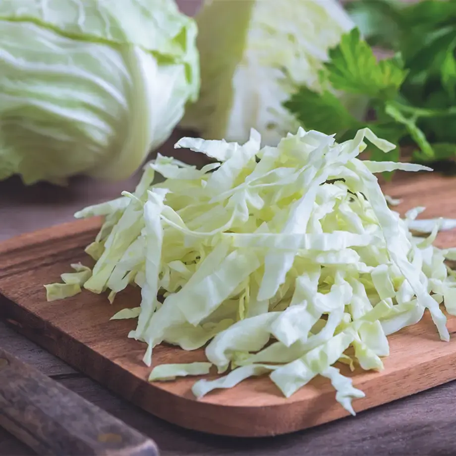 Cut cabbage on a chopping board.