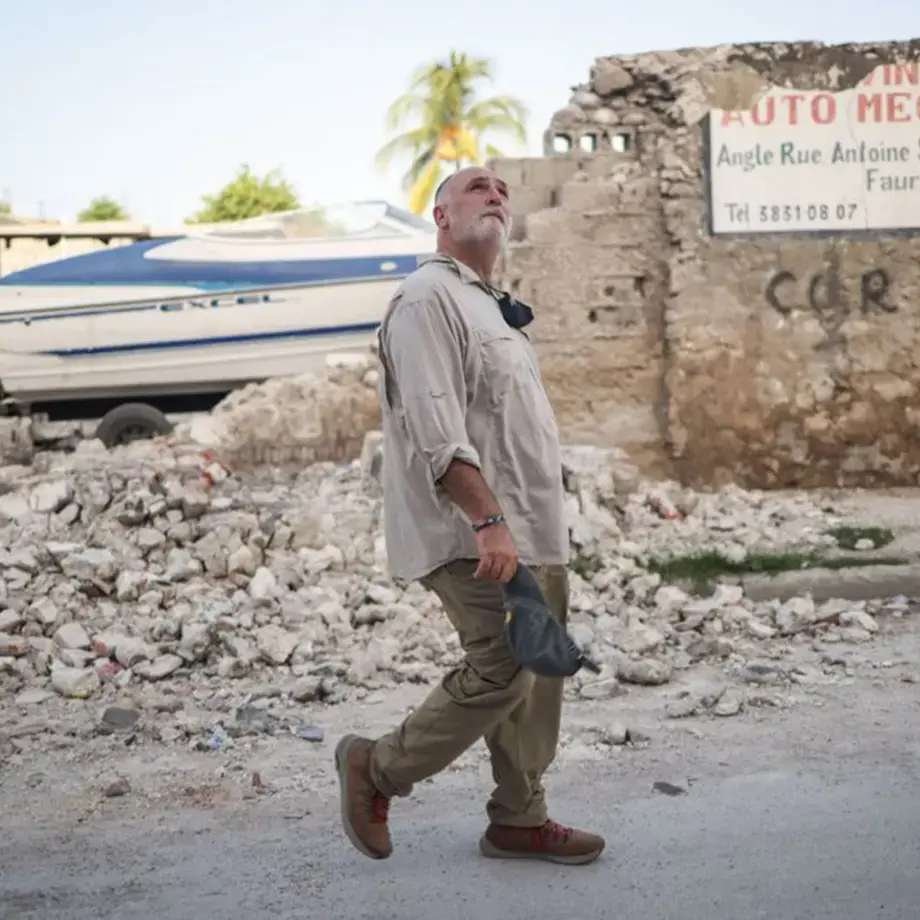 José Andrés waling through rubbles