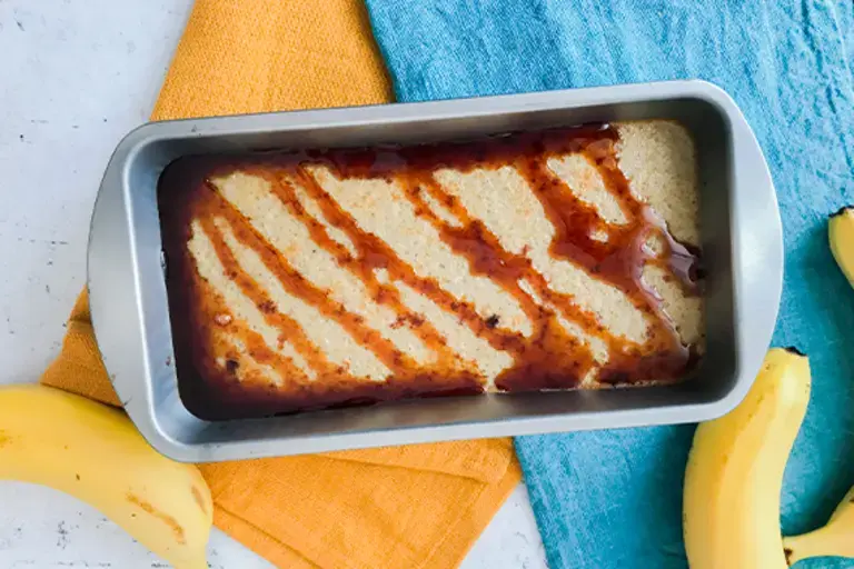A cooked banana pudding in tin