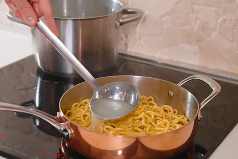 Cooking pasta for carbonara.