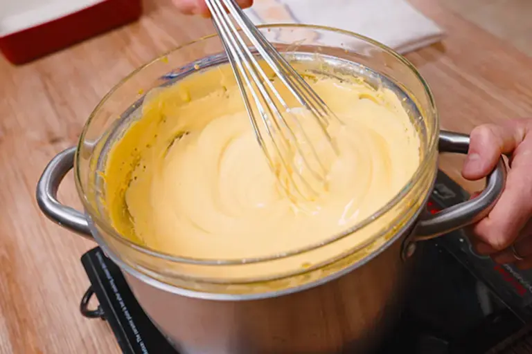 Cooking the mixture in a bain-marie.