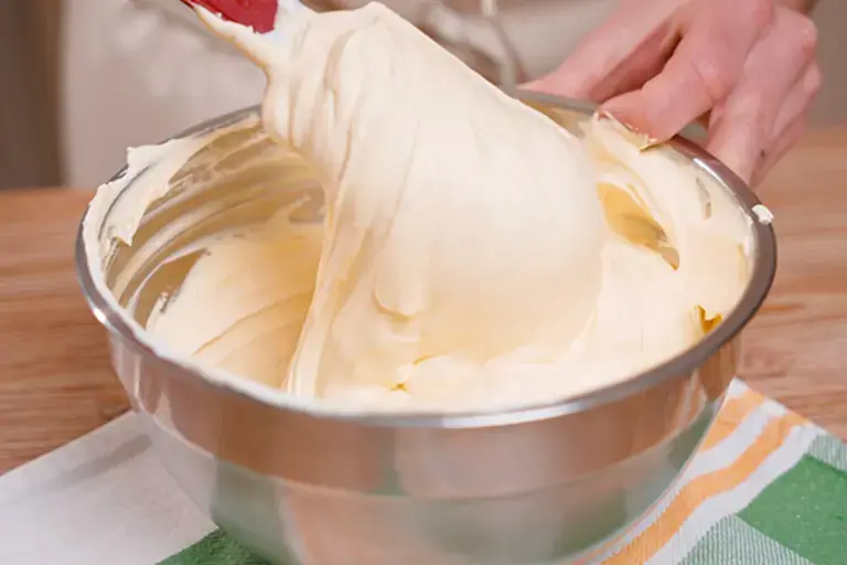 Folding in the whipped cream.