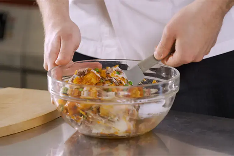 Ingredients being mixed in a bowl.