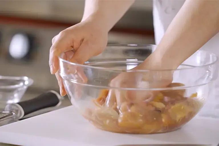 Ingredients being mixed in a bowl.