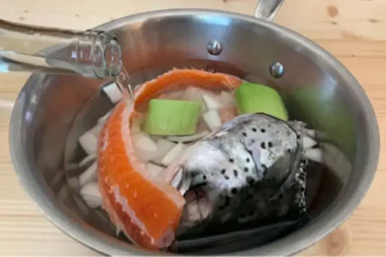 Cooking the trout head Courtesy of Chef Mengxin Zhou