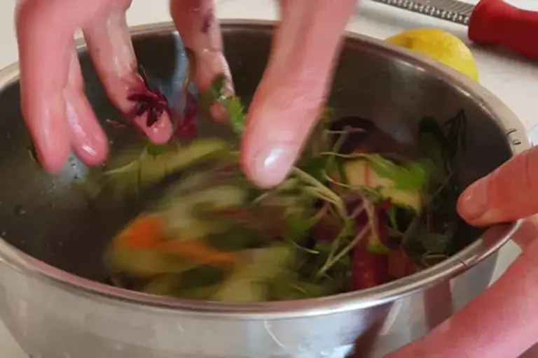 Mixing the salad Courtesy of Chef Marcus Gericke