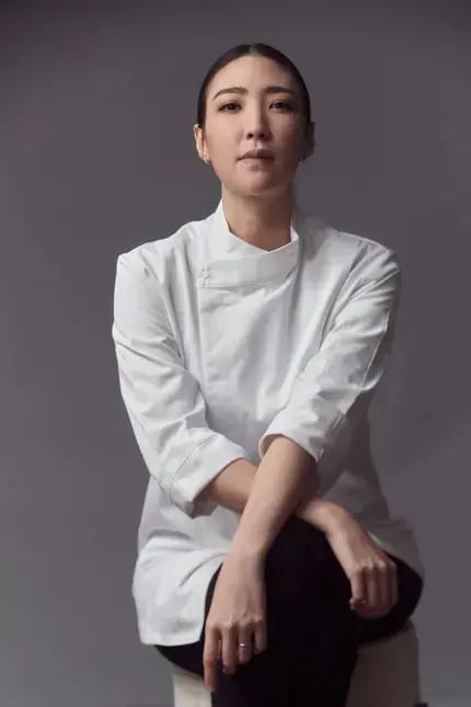 Chef Pam sitting cross-legged.