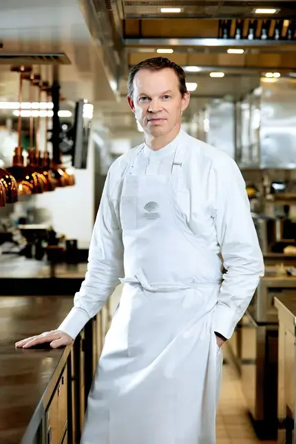 Chef Richard Ekkebus in the kitchen in chef whites.