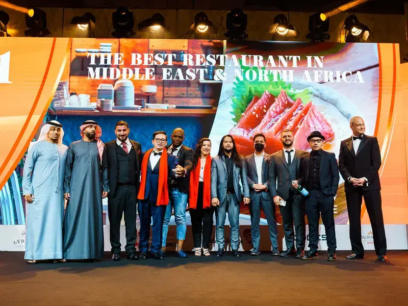 A restaurant team on stage.