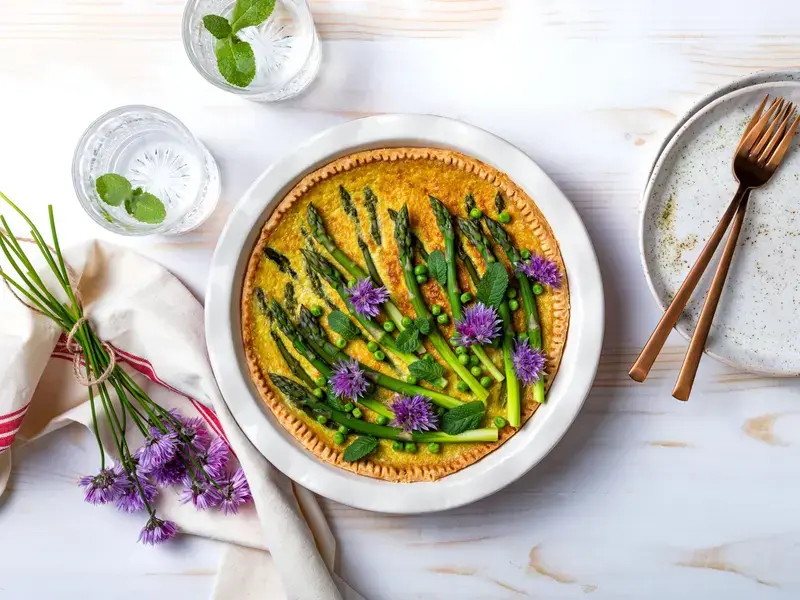 Green asparagus, sweet peas Tart with edible chives flowers or blossoms
